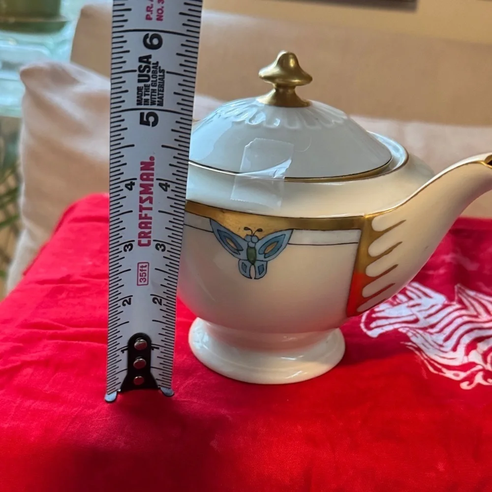 Elegant Gold and Cream Teapot with Blue Accents